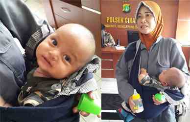 Rusmini, pedagang ayam di Pasar Cikarang bersama bayi yang dititipkan kepadanya saat mendatangi Polsek Cikarang untuk melaporkan peristiwa yang dialaminya, Selasa (19/12) pagi.