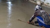 Pembangunan jalan lingkungan di wilayah Kelurahan Bahagia, Kecamatan Babelan, Kabupaten Bekasi.